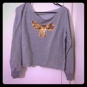 Gray sweater with gold sequin bow detailing