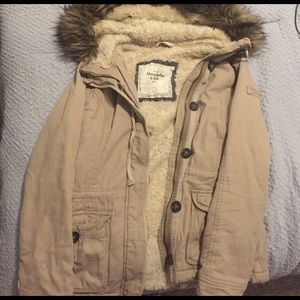 A cozy + warm tan colored coat.