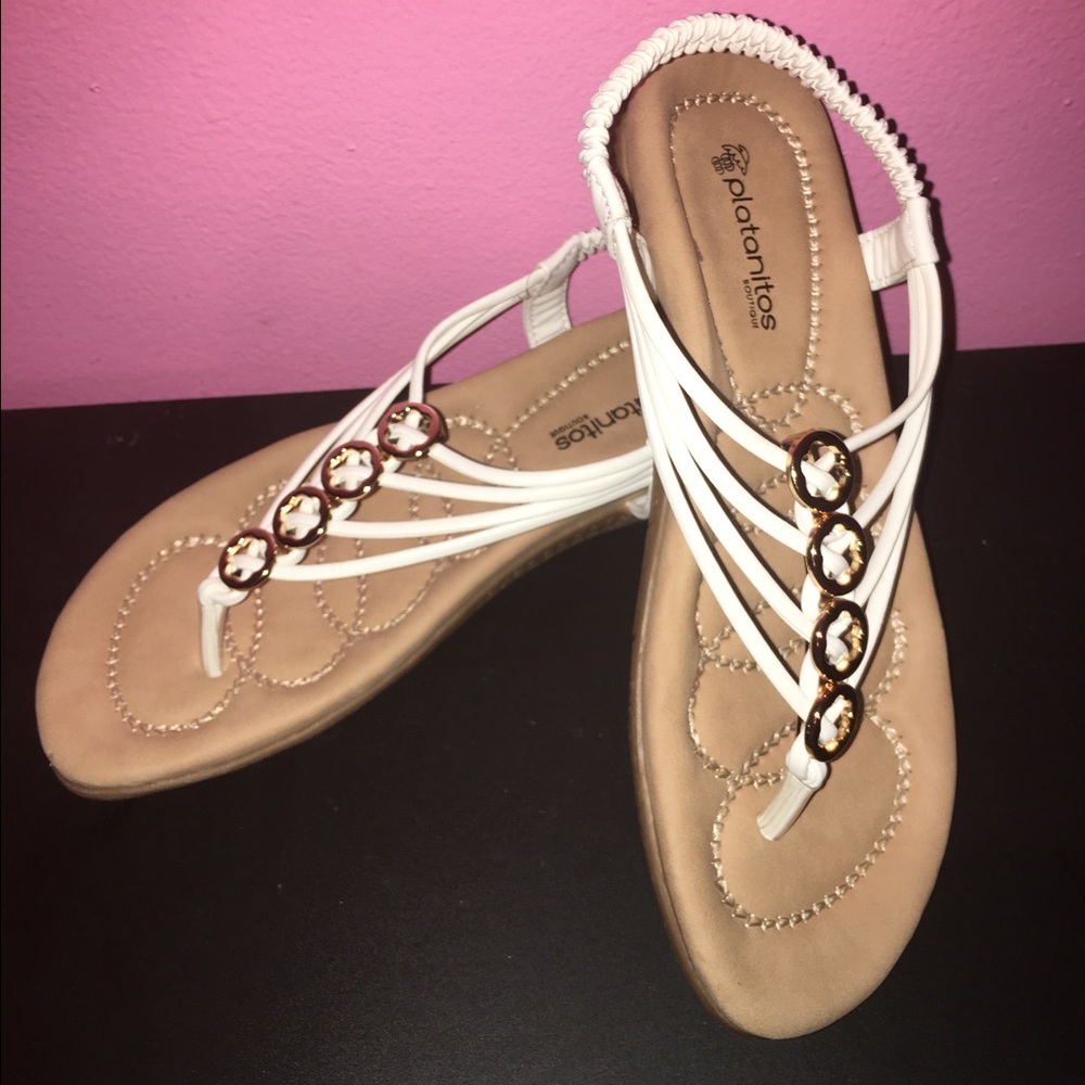 White sandals with gold detail