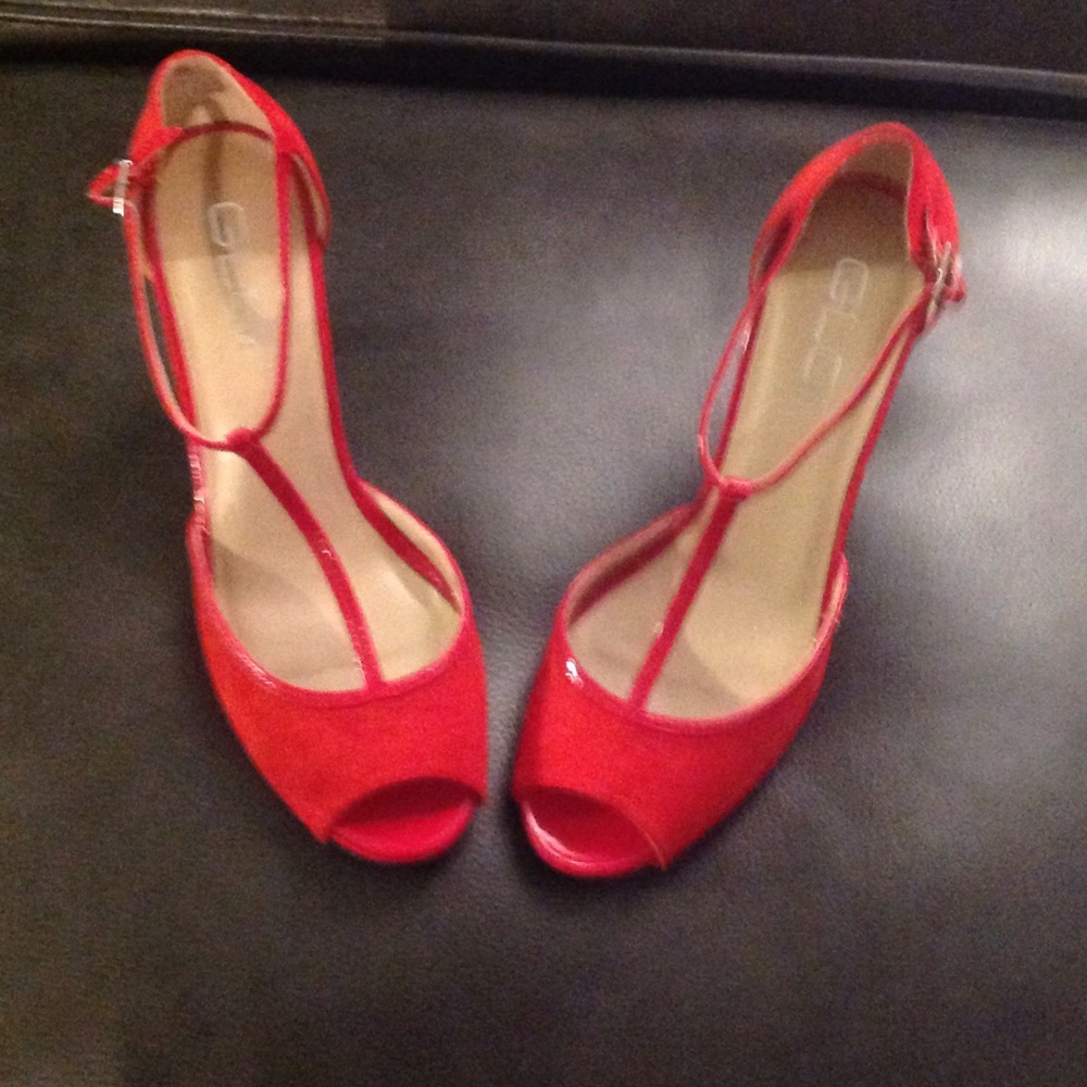Red suede and patent leather peep toe shoes