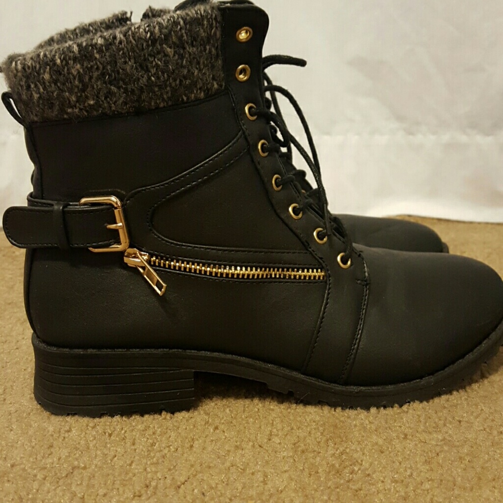 Black ankle boots with gold zipper