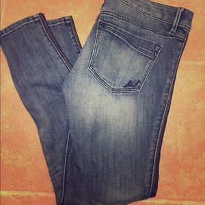 Jeans with black leather stripe down the side