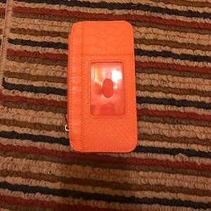 A 6 card holder wallet with two pockets.