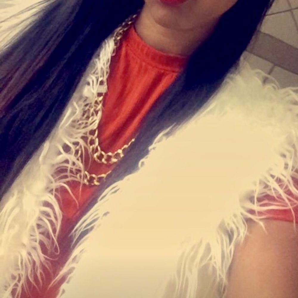 White fur vest