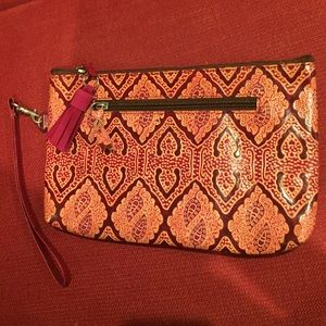 Stamped leather wristlet/clutch