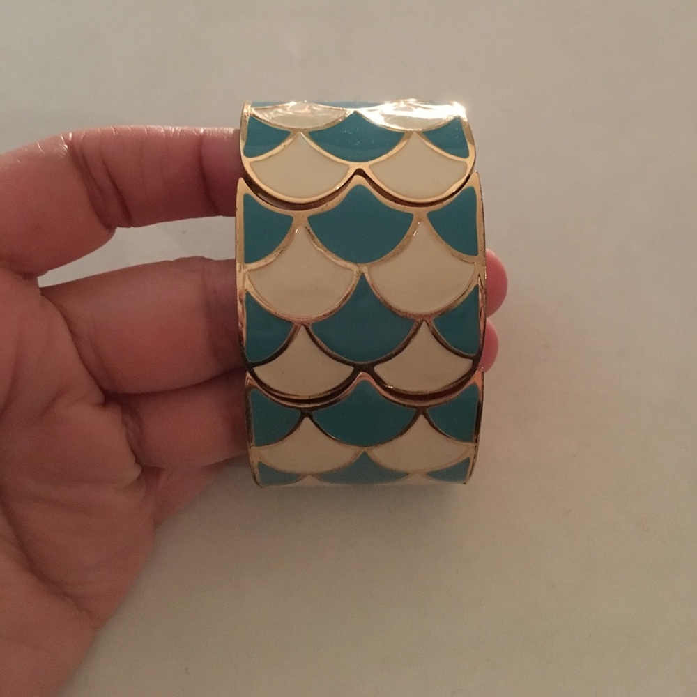 Cream, turquoise and gold stretch cuff. Never worn