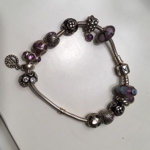 Authentic Pandora charm bracelet. Charms come with