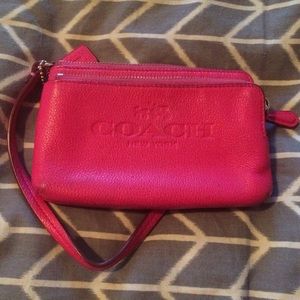 Hot pink Coach wristlet