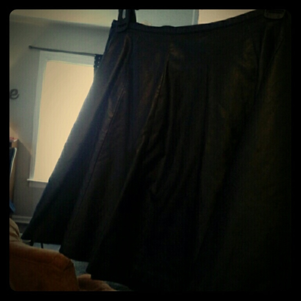 Black, flowey leather skirt.