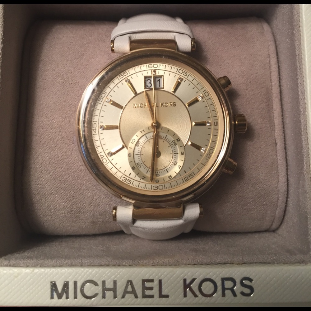 Micheal Kors white chronograph watch.