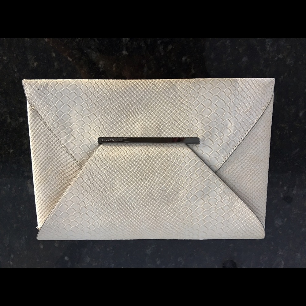 BCBG Python leather clutch