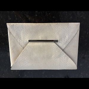 BCBG Python leather clutch