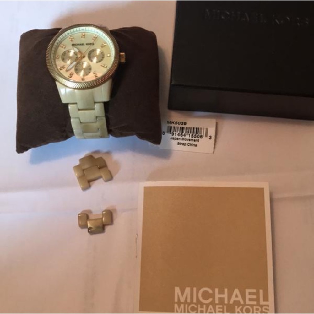 Gold tone watch with tortoise details