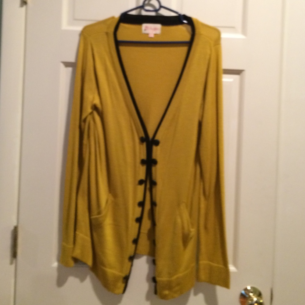 Gold cardigan with black trim