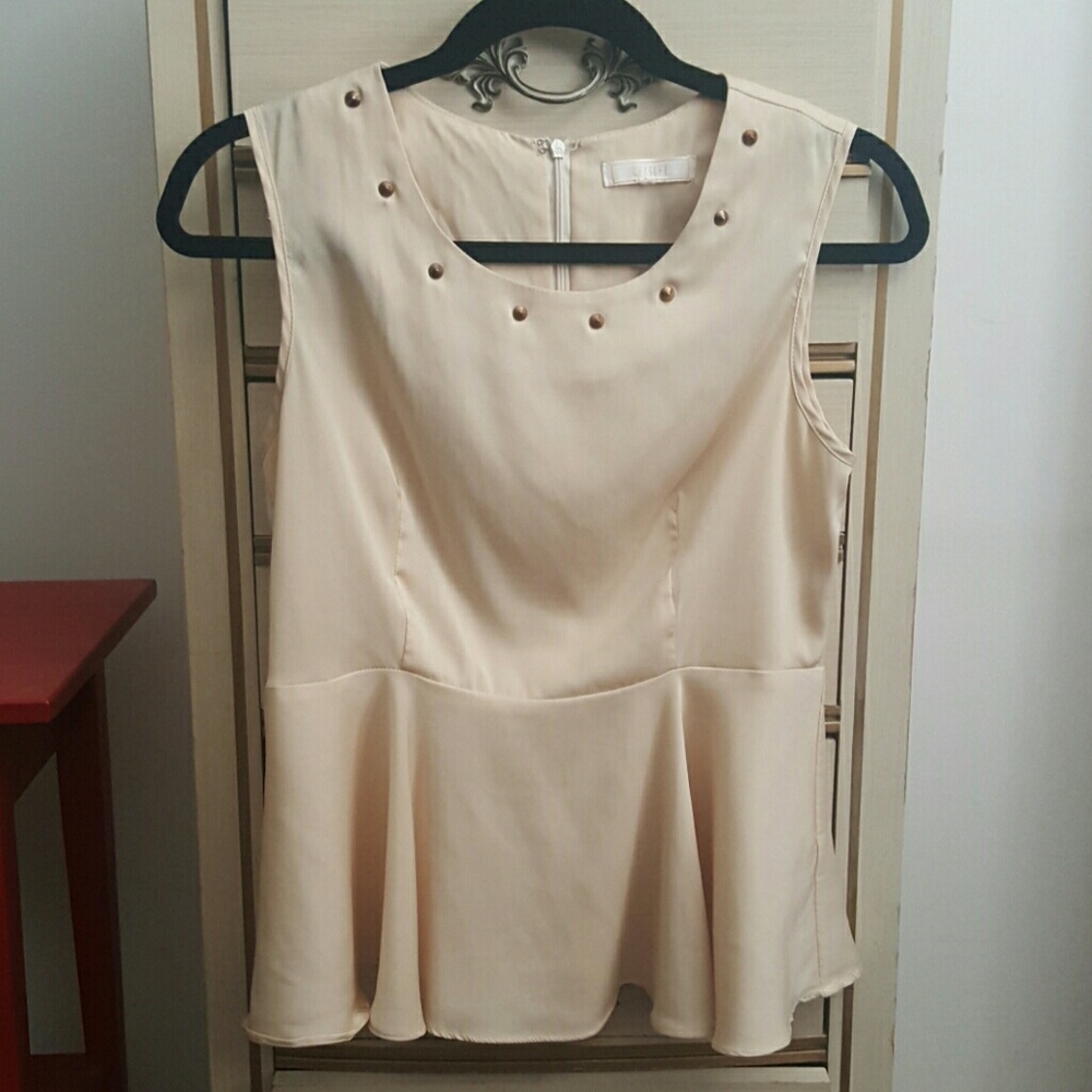 Sleeveless Peplum Top by Chaslee