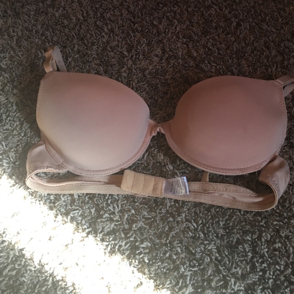 A tanish bra and another one that is white