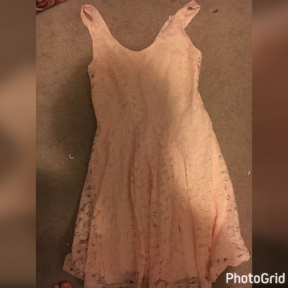A pink lace dress with a sipper in back - Picture 1 of 3