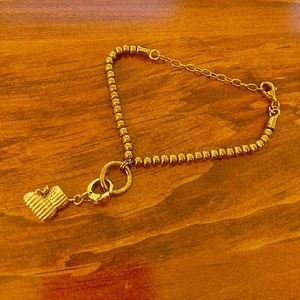 Fossil bracelet with boot pendant
