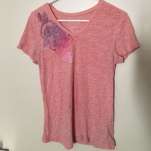 a peach t-shirt