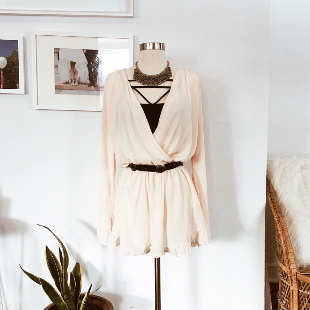 Flirty cream romper with flared sleeves