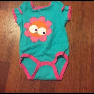 Blue BodySuit With A Face In A Flower 🌺