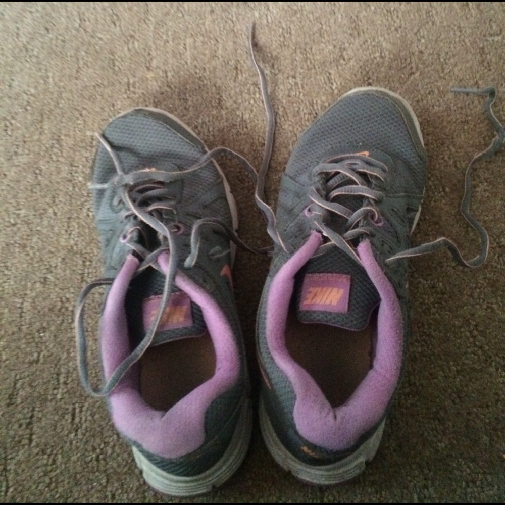 Purple and gray Nike shoes