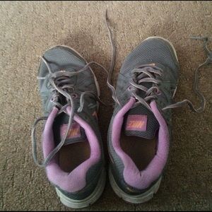 Purple and gray Nike shoes