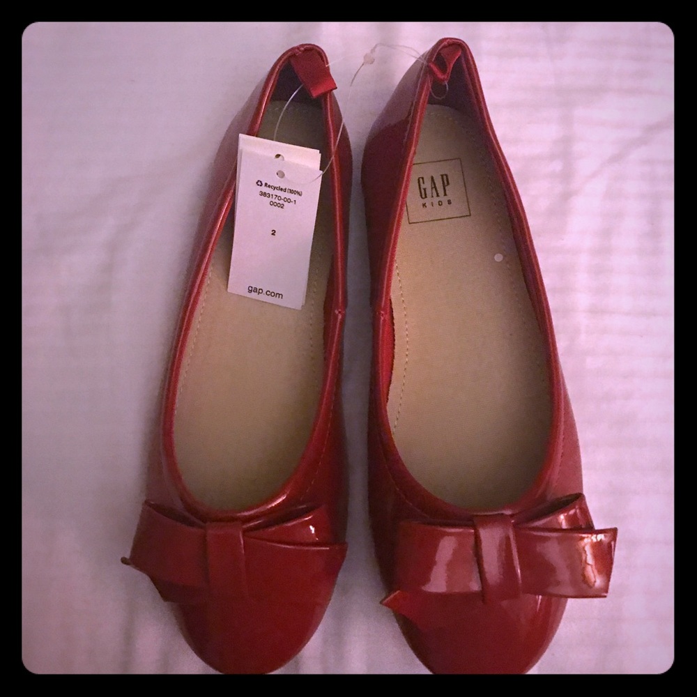 Gap Red Flats with bows.