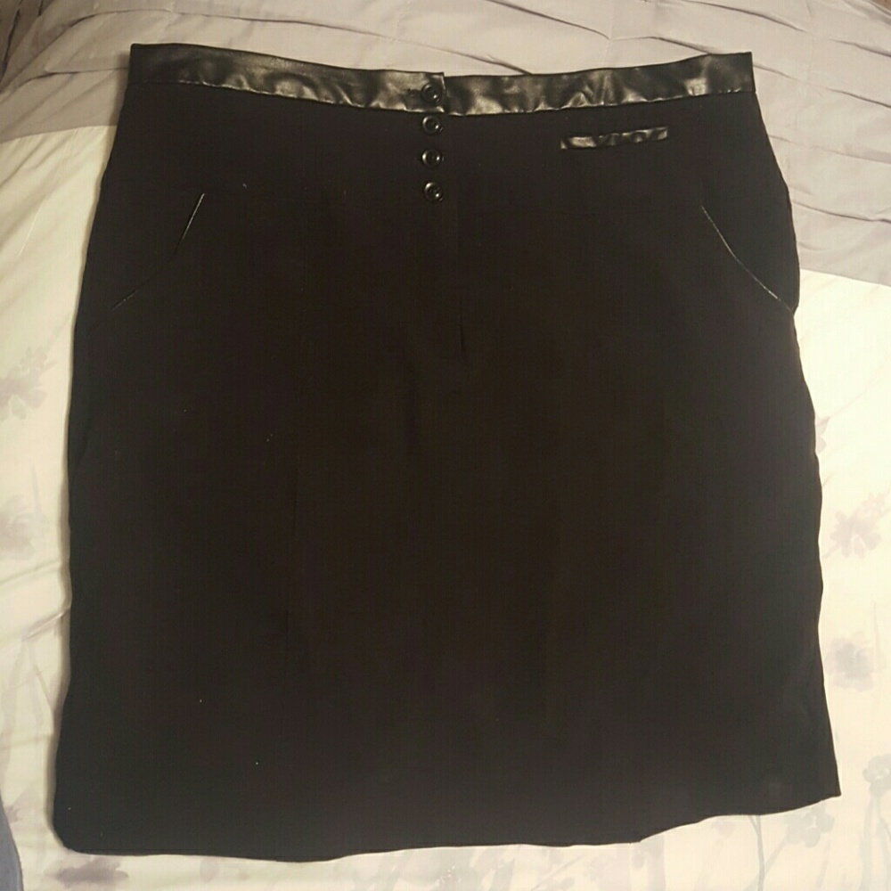 Black skirt with pockets, zipper, and buttons
