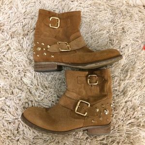 Tan boots with gold studs and buckles