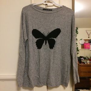 Gray sweater with black butterfly
