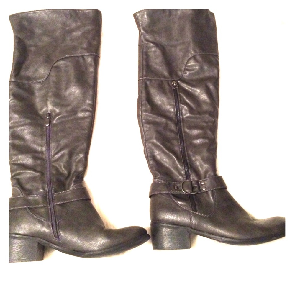 Charcoal gray thigh high boots.