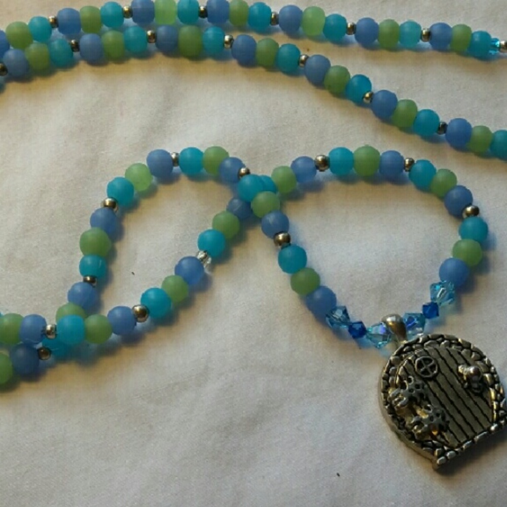 Necklace with beautiful beading, and Lil door