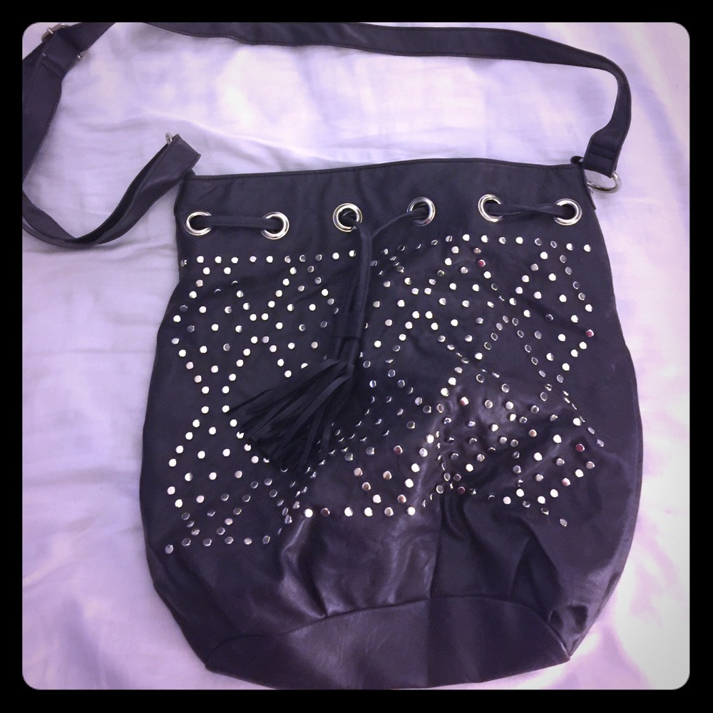 NWOT purple leather bucket bag with silver studs
