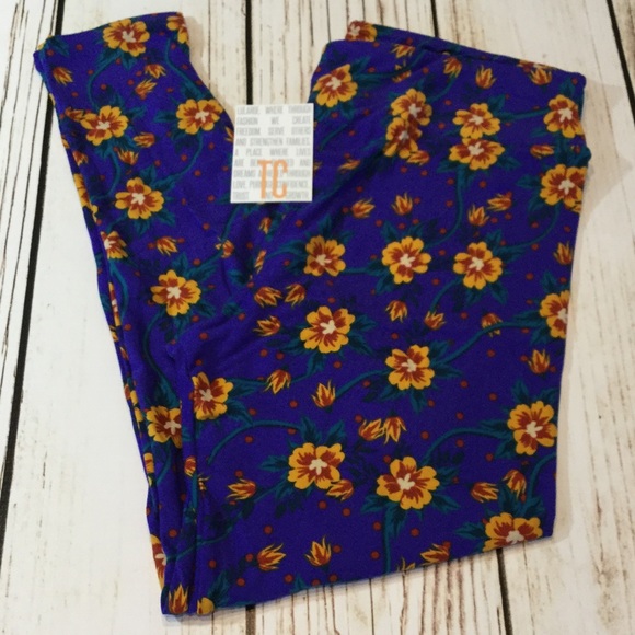LuLaRoe Pants - 🍃NWT blue background with flowers and stems.