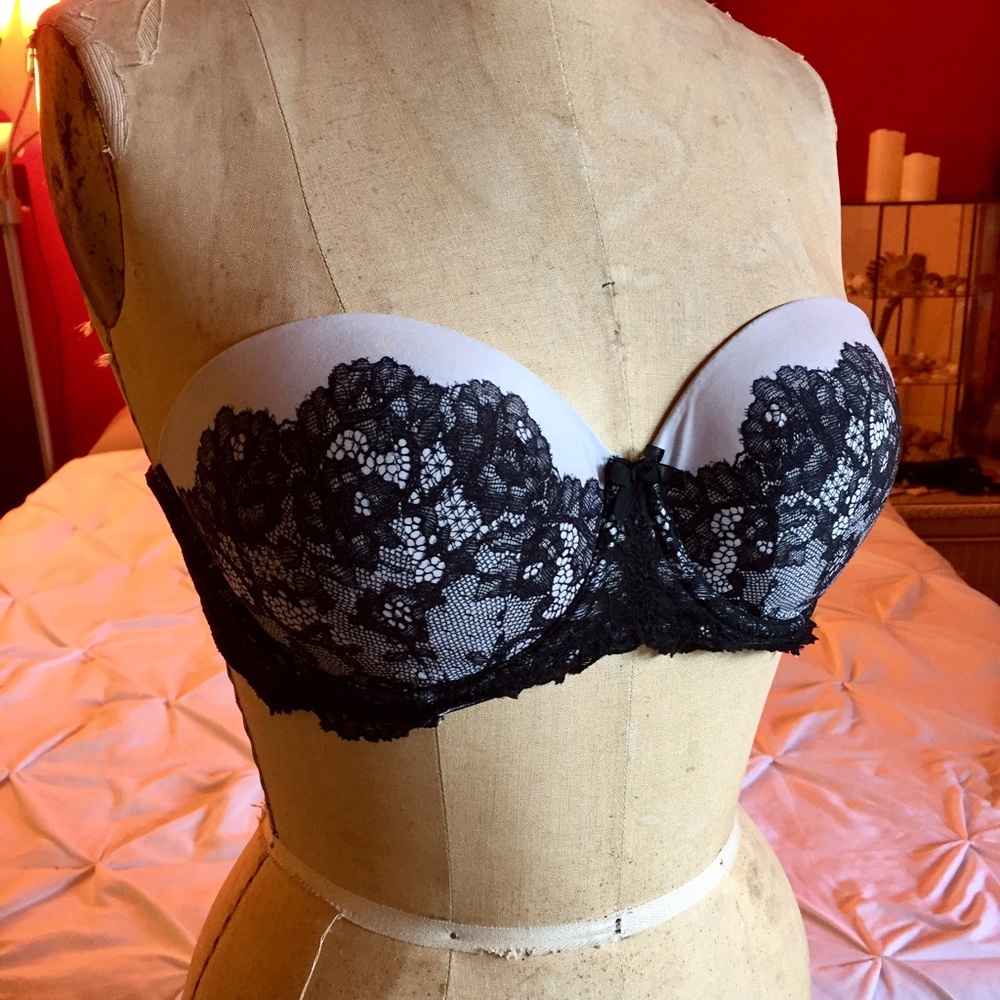 Strapless bra with black and white lace pattern.