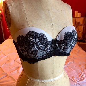 Strapless bra with black and white lace pattern.
