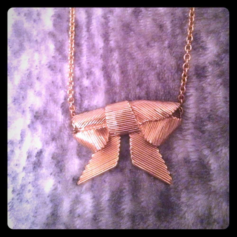 Kate Spade gold bow necklace. New with tags