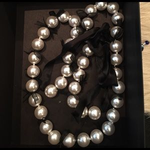 Large faux pearl necklace with black ribbon detail