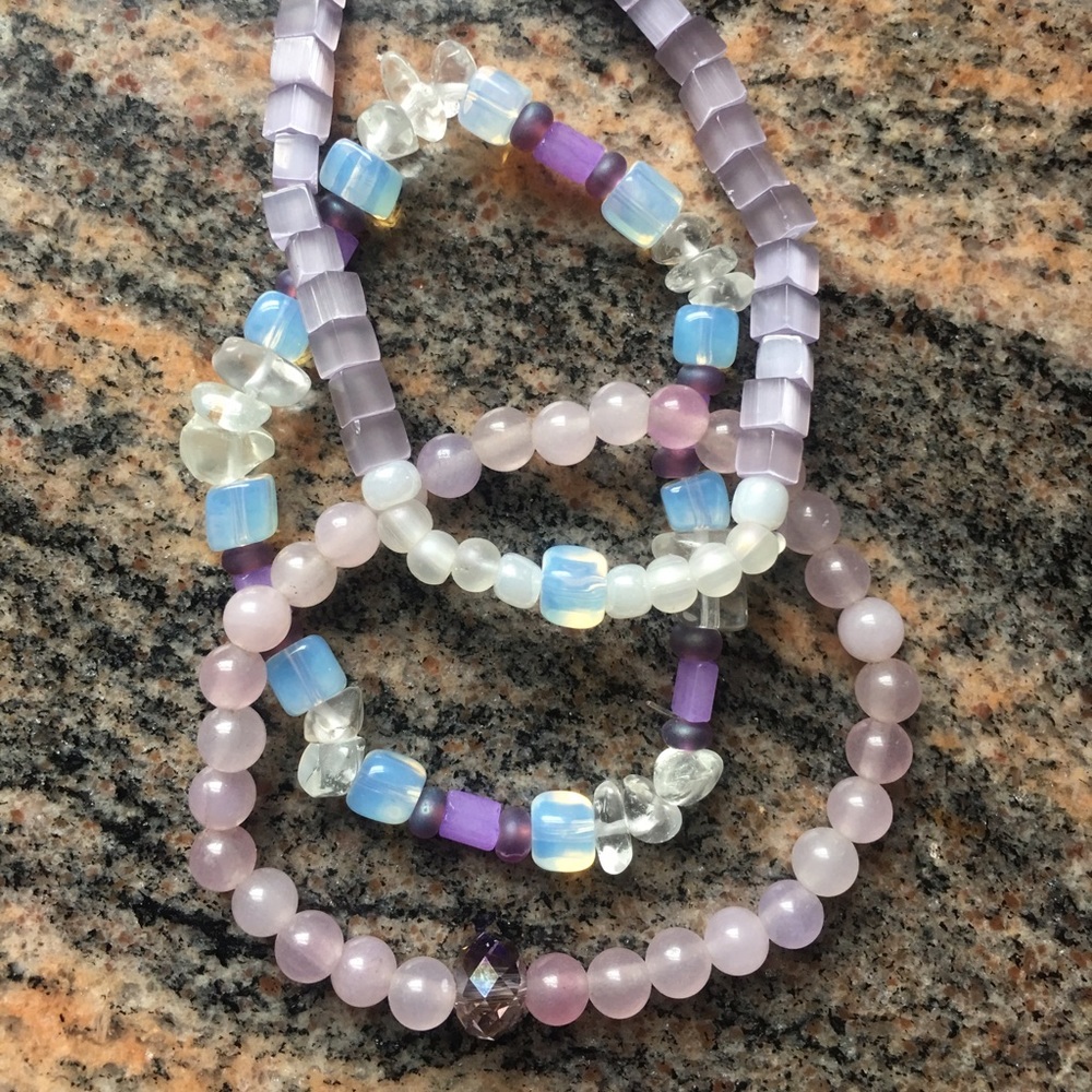 Set of three purple themed stretch bracelets