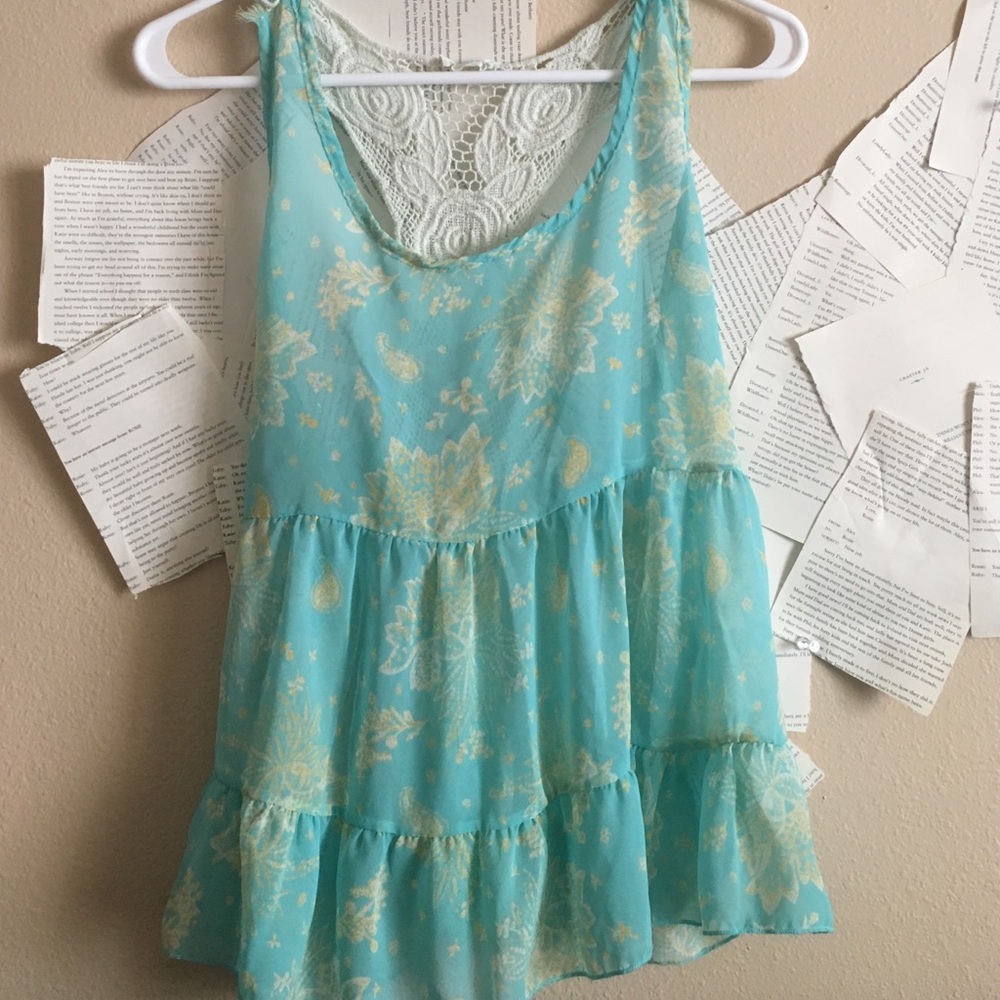 flowy racerback top with floral design, size med.