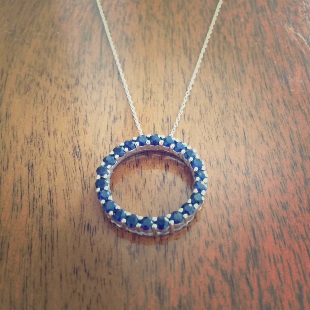 Circle sapphire pendant necklace.