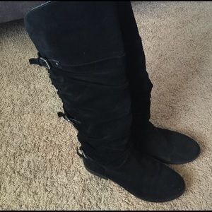 Tall black suede boots
