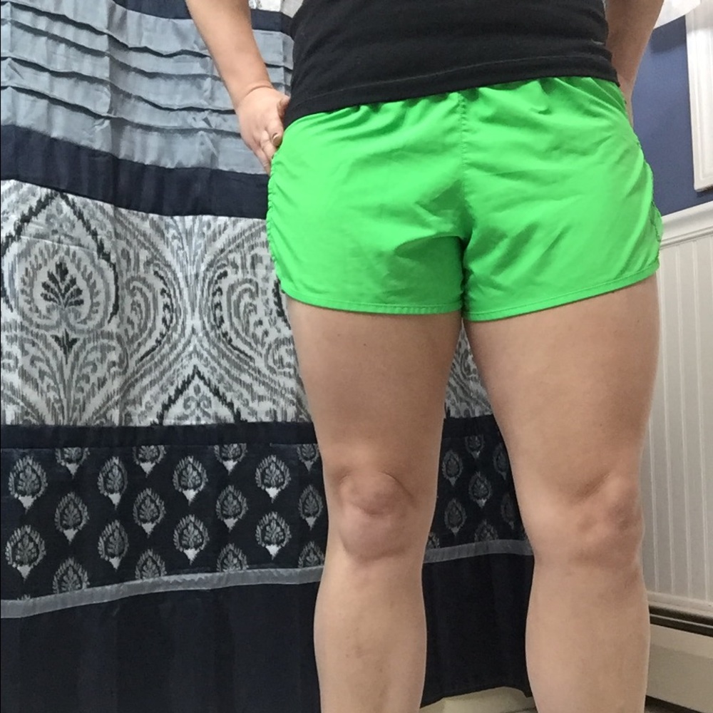 Bright green size small reebok running shorts.