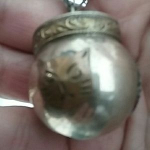 Sterling silver chime pendant on leather cord