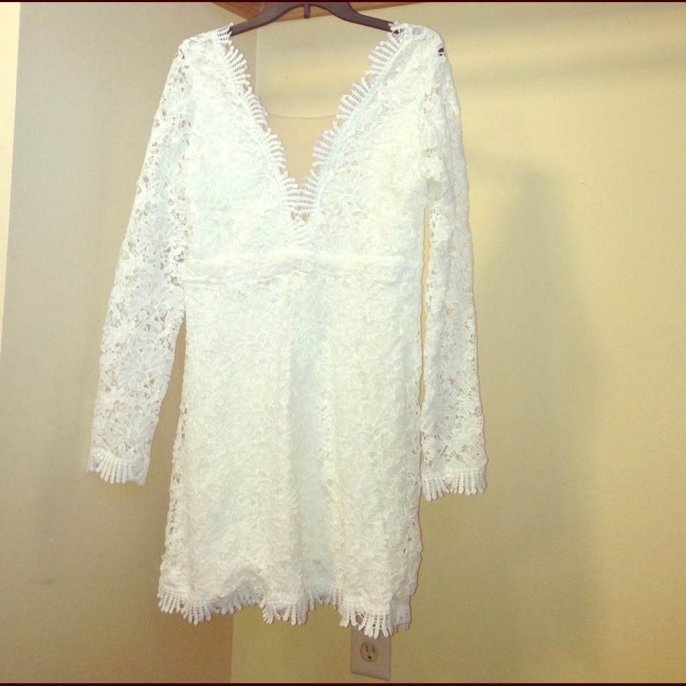 Elegant white lace plunge dress