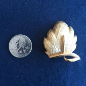 Gold tone 1960's leaf brooch....signed "STAR"