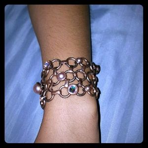 Bronzed braclet with semi colored jewels