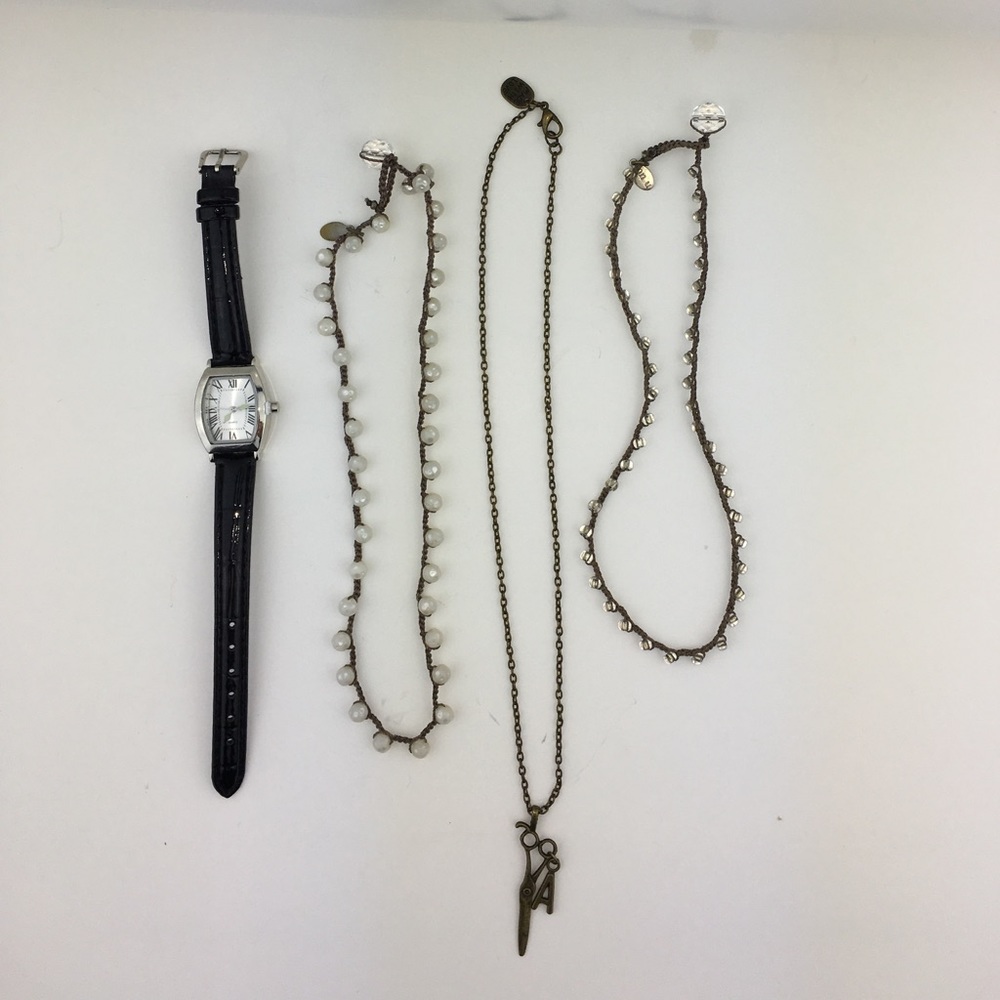 Three handmade necklaces and one ⌚️ watch.