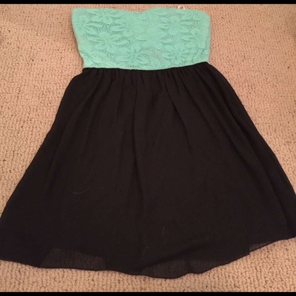 Light blue and black strapless dress.